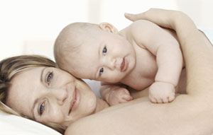 Mother embracing baby